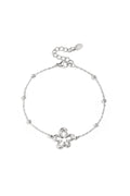 Armband met koraalvormige speelse bloemen in variërende maten