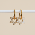 Goudkleurige Star Shine oorbellen van stainless steel met glinsterende sterhangers, sieraden