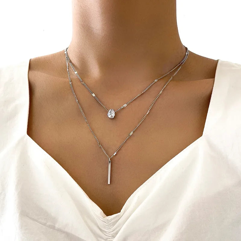 Zilverkleurige dubbele ketting met hanger van waterdruppel en langwerpige bar, dames trendy sieraad