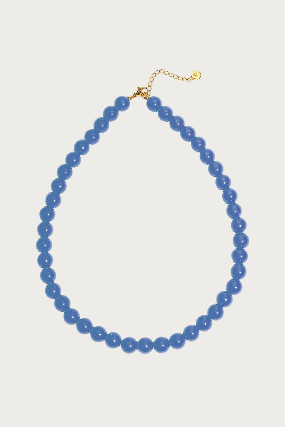Mira blauwe kralenketting van roestvrij staal, met gouden sluiting en verlengkettinkje, klassieke dames ketting.