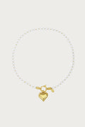 Gouden stainless steel ketting met parels en een hartvormige hanger, modieuze dames sieraden.