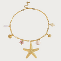 Gouden choker ketting van stainless steel met zeester, schelpen en parelbedels.