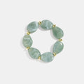 Squoval kralenarmband met grote mintgroene resin stenen en gouden stainless steel accenten, modieuze damesarmband.