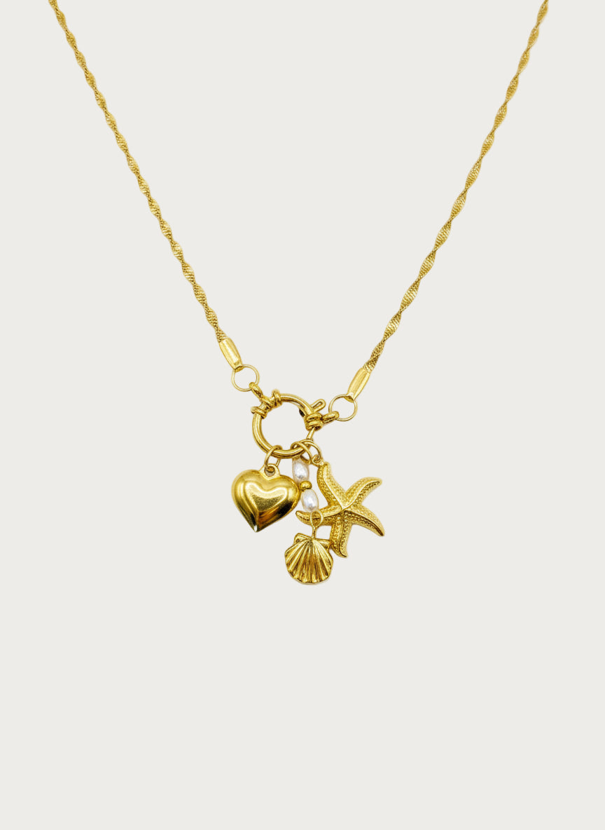 Gouden stainless steel ketting met hart, starfish, schelp en parel bedels
