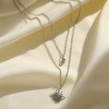 Zilverkleurige dubbele ketting van roestvrij staal met sterrenbedel en klein diamantje, perfect dames sieraad.