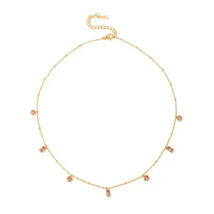Gouden stainless steel ketting met roze ronde en rechthoekige steentjes, verstelbare sluiting.