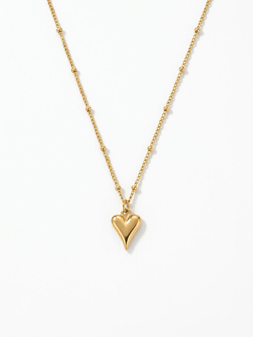 Gouden hartjes ketting van stainless steel met bolletjes detail, modern dames sieraad