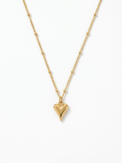 Gouden hartjes ketting van stainless steel met bolletjes detail, modern dames sieraad