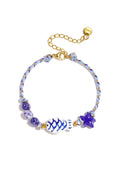 Kralenarmband met touwmotief, vis en ster kralen