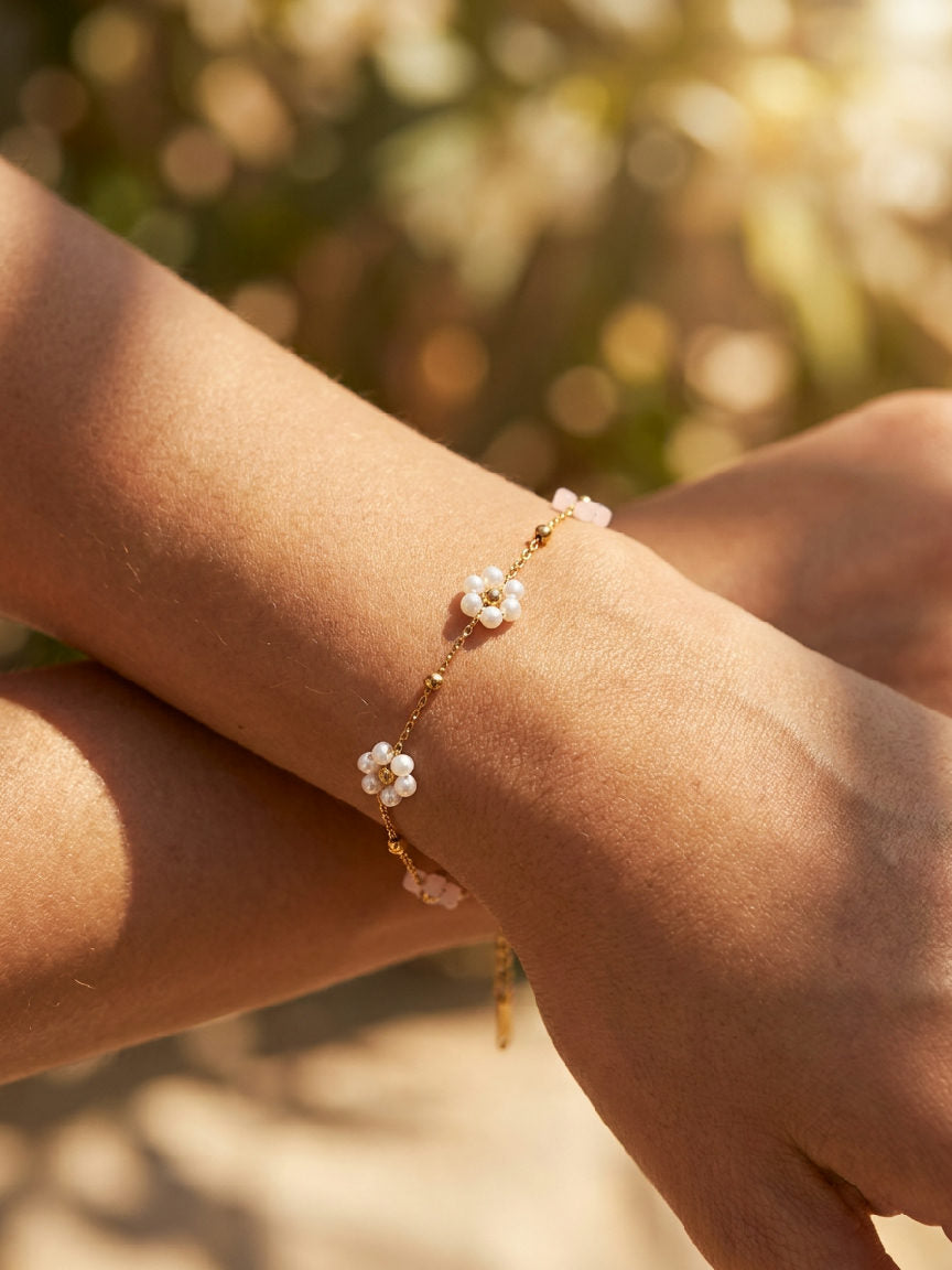 Elegant light-pink stainless steel bracelet with a sleek design, perfect for adding a touch of summer chic to any outfit.