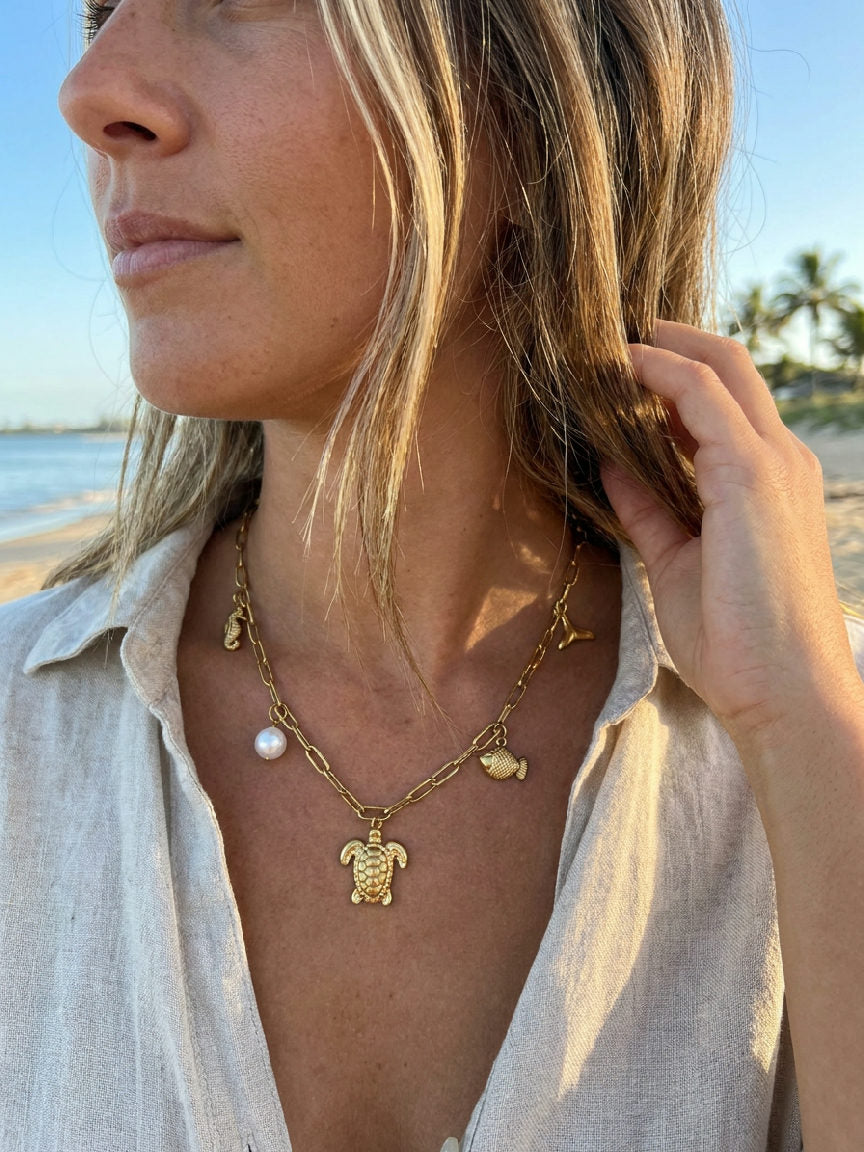 Stainless steel necklace with a detailed turtle pendant, worn by a person, symbolizing wisdom and longevity, perfect for ever